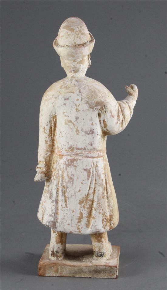 A Chinese pottery figure of a standing official, Ming dynasty 27.5cm